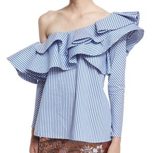 Blue ruffled top, similar to that of Johanna Ortiz